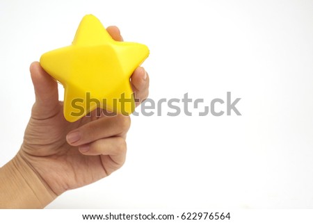 Hand holding stress ball isolated on white background.