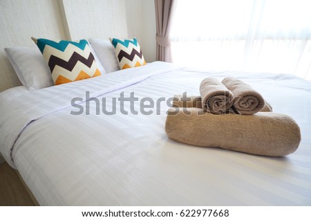 Beautiful bedroom interior and towels