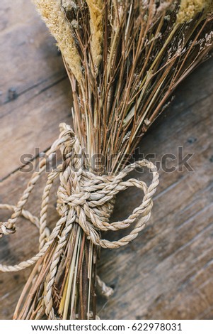 old fashion dry grass flower on wood,tone color edit