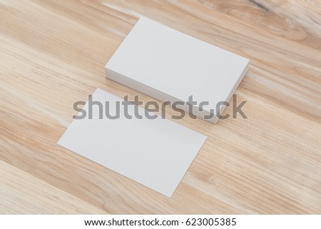Business cards on wood table.