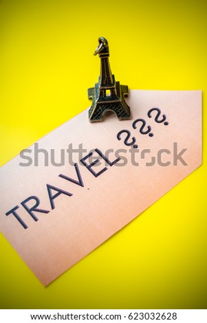 new impression, new experience. Time to travel. Holidays idea. Small symbol of france. Eiffel tower on yellow background. Vertical photo. europe trip.