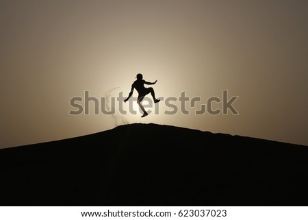 Isolated man on Desert Dune Adventure, finds freedom in loneliness. Amazing Dubai Holiday. Travel after Lockdown, the new Normal.