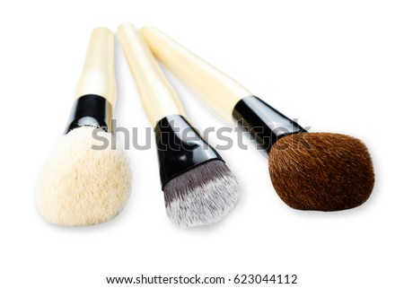 Cosmetics and beauty. Make-up brushes set in row on white isolated background. Selective focus, shallow depth of field