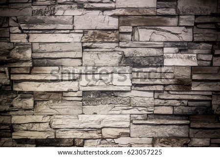 Granite stone wall for background.