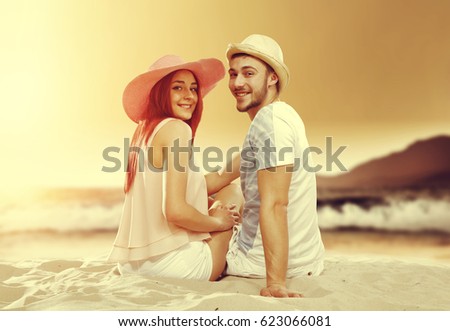 Summer sunset time on beach and two lovers 