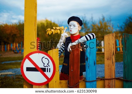 A person in the form of a mime refuses to smoke. The concept of quitting smoking and a healthy lifestyle.