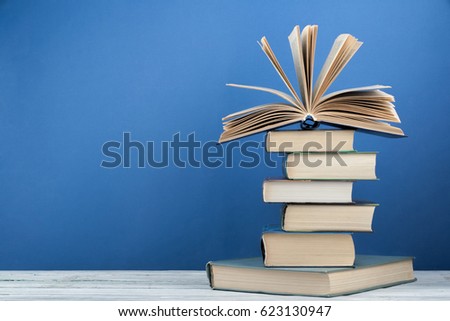 Stack of colorful books. Education background. Back to school. Book, hardback colorful books on wooden table. Education business concept. Copy space for text Royalty-Free Stock Photo #623130947