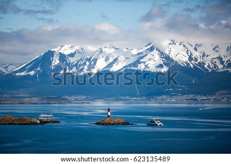 Tierra del Fuego,  landscape of snowy and wooded mountains and ocean Royalty-Free Stock Photo #623135489