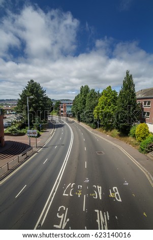 Western Way in Exeter. View from the pedestrian bridge above the road, connecting the remains of the ancient Roman wall (Yaroslavl Bridge). Without cars. Devon. England