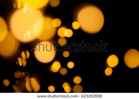 Blurred de-focused bokeh lights on black background