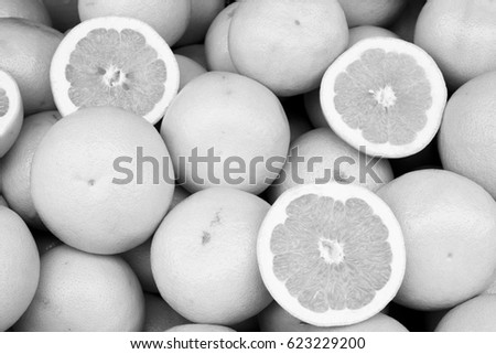 Grapefruit at a market place. Black and white photo.