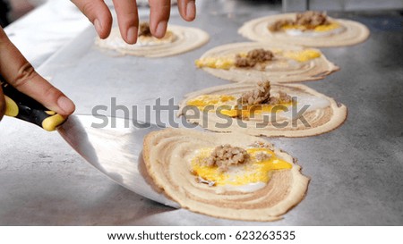 Making egg crepes , Thai street food