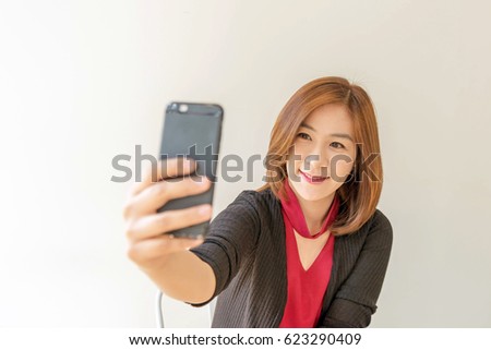 Asian woman take photo by phone. Selfie.