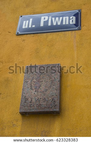 Sign on the wall of the old street Piwna in Warsaw, Poland