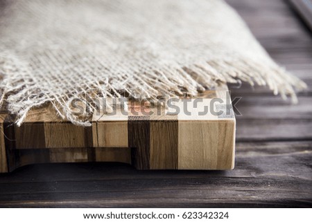 Background texture of a wooden Cutting plank made from log cabins of different trees