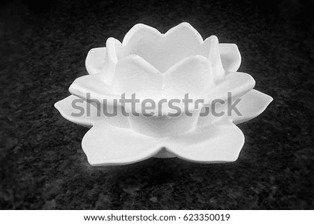 White candlestick in the shape of lotus