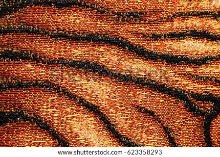 Texture - background of gobelin fabric of tiger coloring
