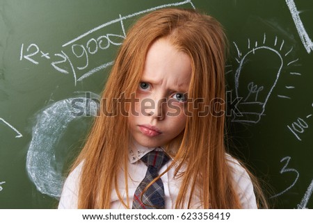    Little girl schoolgirl sad      