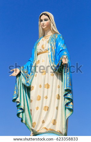 The blessed holy women Lady of Lourdes, grace virgin mother mary roman catholic statue figure. praying Church steadiliy religious pilgrimage mother of Jesus. Marian devotion Our Lady of Miracles. Royalty-Free Stock Photo #623358833