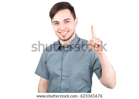 Young man with a forefinger up, "got idea" gesture, isolated. Casually handsome. Confident young handsome man while standing against white background. Happy Young Man Isolated Background.