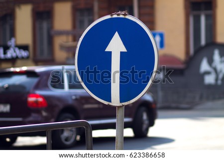Blue road sign with arrow
