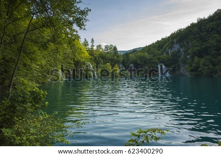 Plitvice Lakes Croatia Europe. Beautiful nature and landscape photo. Nice warm summer day. Lovely outdoors image with lake, trees and waterfalls. Joyful and happy picture.
