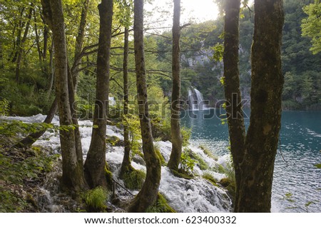 Plitvice Lakes Croatia Europe. Beautiful nature and landscape photo. Nice warm summer day. Lovely outdoors image with lake, trees and waterfalls. Joyful and happy picture.