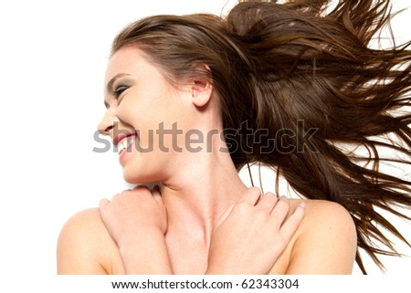 Gorgeous long hair brunette girl smiling on white background