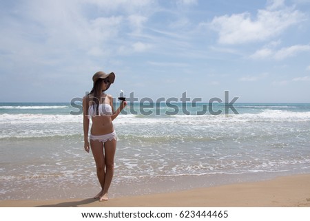 The girl by the sea. Vacation in hot Spain on the Mediterranean coast