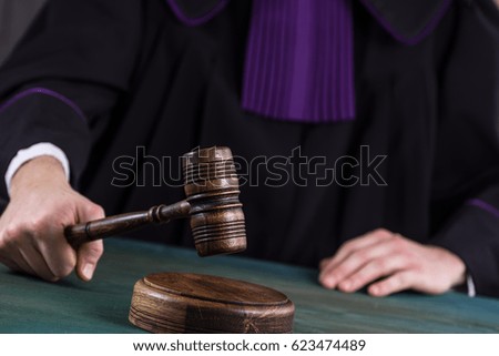  Judge in courtroom. Mallet and Scale