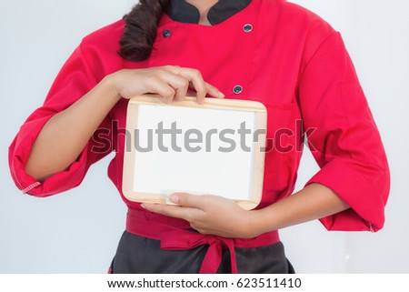 Chefs in red costume holding blank banner labels for presentations on menus and restaurants on white background.