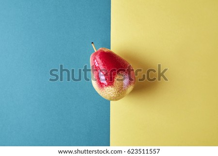 Whole fresh pear fruit view from above on green yellow background, modern style food picture, pattern design