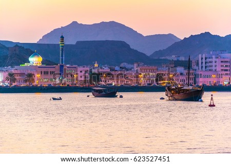 View of coastline of Muttrah district of Muscat during sunset, Oman. Royalty-Free Stock Photo #623527451