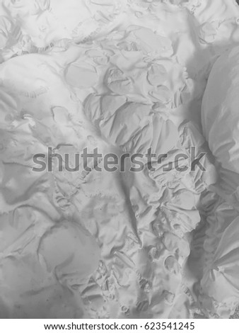 An old deflated balloon looks like topography of an alien landscape. Royalty-Free Stock Photo #623541245