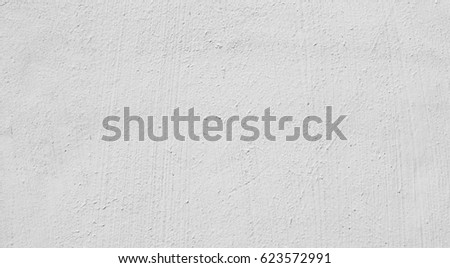 White plaster wall background, abstract pattern. Concrete wall texture close-up.