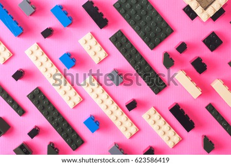 Childrens toy blocks. colorful details on a pink background, pattern
