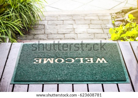 Green welcome mat