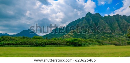 Panorama of the mountain range by Kualoa Ranch in Oahu, Hawaii. Famous movies and TV shows like "Lost", "50 First Kisses" and "Jurassic Park" were filmed here