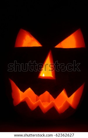 Jack-o-lantern glowing on black background