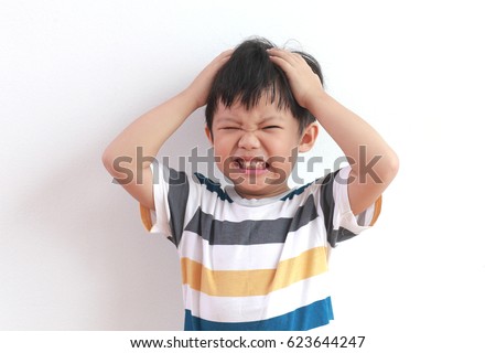 Cute Little Asian Boy Feel Strain, Angry, Bored Royalty-Free Stock Photo #623644247