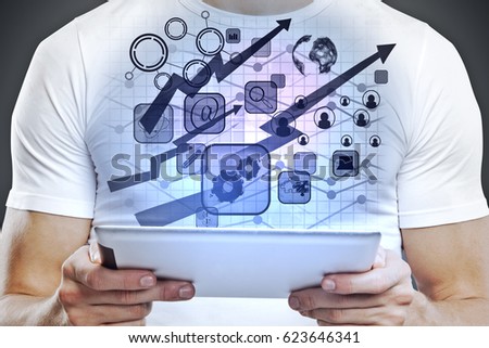 Man using tablet with digital business charts and arrows. Fund management concept