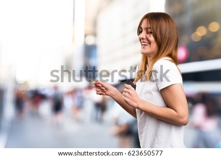 Beautiful young girl dancing on unfocused background