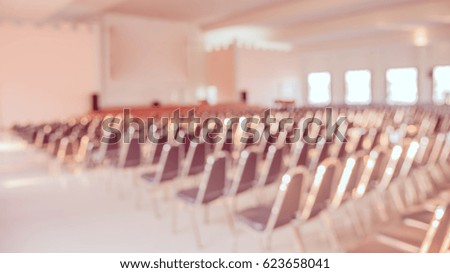 vintage tone blurred image of empty auditorium room for background usage.