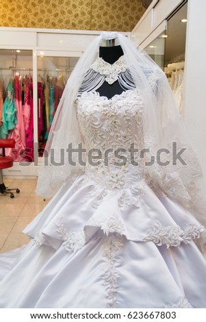 white wedding dress gown on mannequin in bridal gown. Bride's morning wedding preparation concept