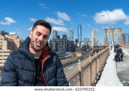 Young european tourist on Brooklyn Bridge in New York City, USA.