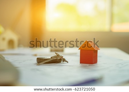 close up  symbol of home model,mortgage, investment, real estate and property concept , money and house keys,selective focus,vintage color