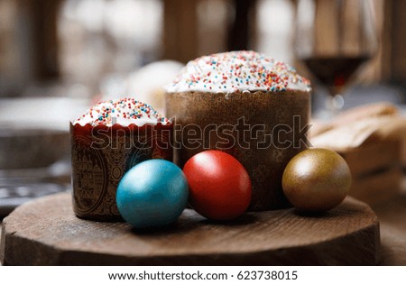 Decorated home made Easter cake & painted colorful chicken eggs for spring Christian Orthodox holiday celebration.Enjoy decorative tasty homemade food