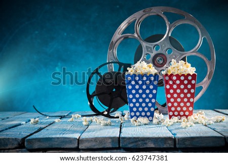 Old style movie reels with pop corn, still-life, close-up.