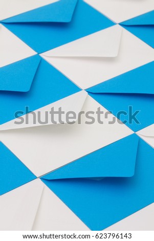 Composition with white and blue envelopes on the table.