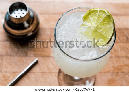 Daiquiri cocktail with lime and crushed ice.
